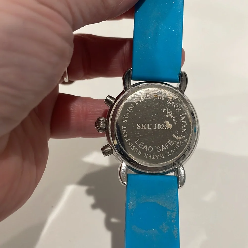 Stainless steel watch with multi color numbers and turquoise band. EUC